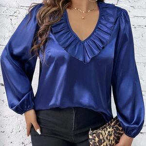 Blue satin blouse.